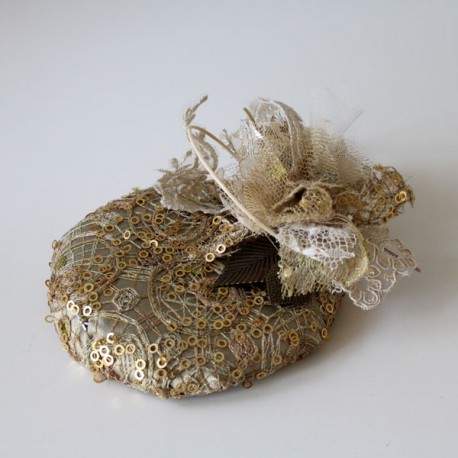 Gold lace and flowers cap.