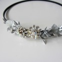 golden turban with silver flower ornament and gray clasp