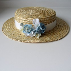 Canotier with white ribbon and blue flower
