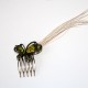Green butterfly comb with raffia feathers