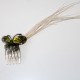 Green butterfly comb with raffia feathers